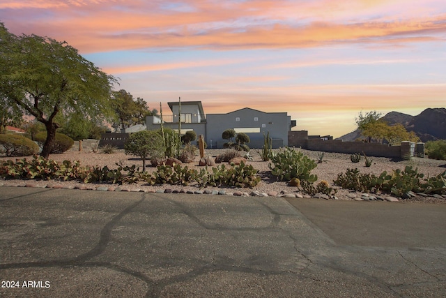 yard at dusk with a mountain view