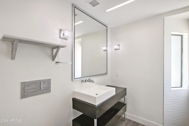 bathroom featuring vanity and wood-type flooring