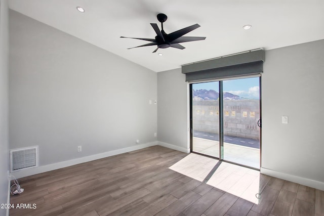 spare room with hardwood / wood-style flooring and ceiling fan