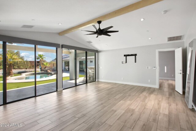 unfurnished room featuring lofted ceiling with beams, light wood-type flooring, and ceiling fan