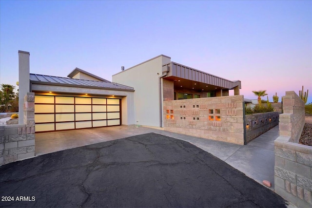 view of front of property with a garage