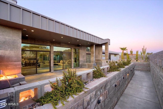 view of patio terrace at dusk