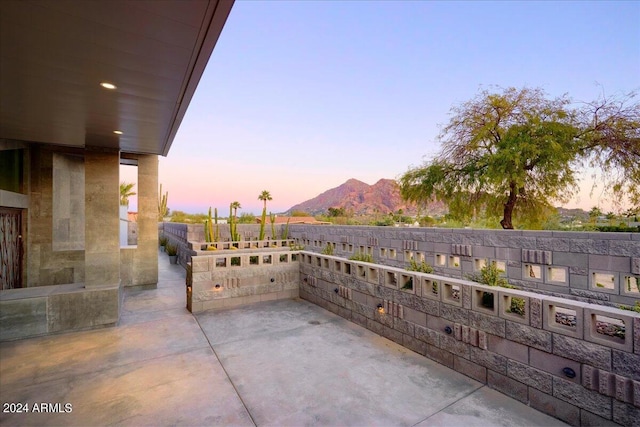 patio terrace at dusk with a mountain view