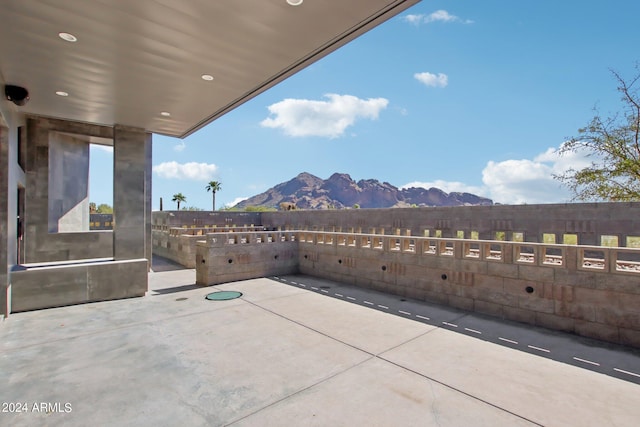 view of patio / terrace featuring a mountain view