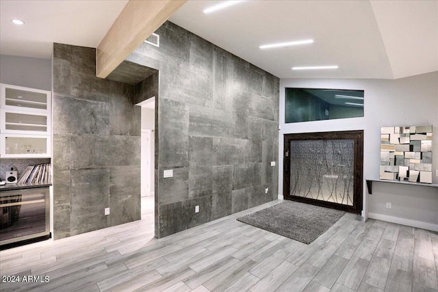 interior space featuring high vaulted ceiling and wood-type flooring