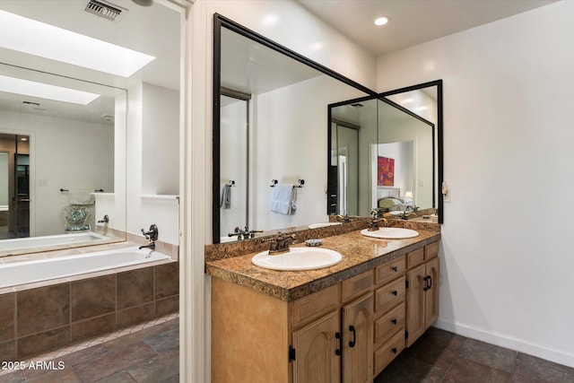 4015 N 78th St Unit 135, Scottsdale, AZ 85251 - full bathroom with double vanity, stone tile floors, and a bath