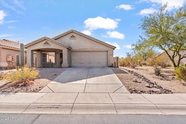 4657 E Matt Dillon Trl, Cave Creek, AZ 85331 - view of front facade with a garage, driveway, stucco siding, and a tiled roof
