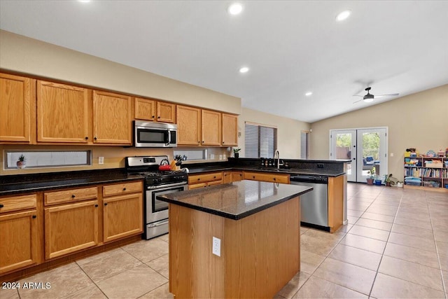 4657 E Matt Dillon Trl, Cave Creek, AZ 85331 - kitchen with appliances with stainless steel finishes, a sink, a peninsula, a kitchen island, and vaulted ceiling