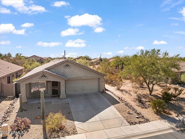 4657 E Matt Dillon Trl, Cave Creek, AZ 85331 - view of front facade featuring a garage, stucco siding, and driveway