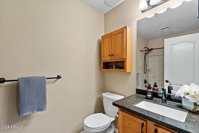 4657 E Matt Dillon Trl, Cave Creek, AZ 85331 - bathroom with vanity, toilet, a shower, and a textured wall