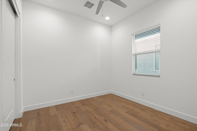 unfurnished room featuring hardwood / wood-style floors and ceiling fan