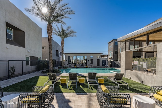 view of swimming pool with a patio