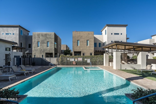 view of swimming pool with a patio area