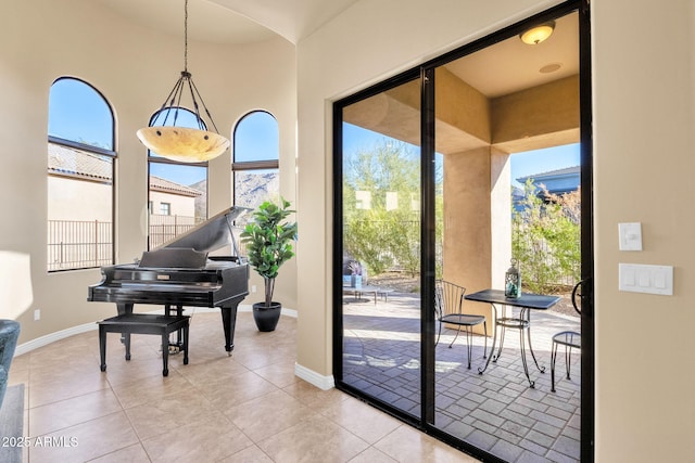 doorway to outside featuring light tile patterned floors