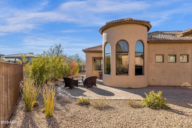 rear view of house with a patio