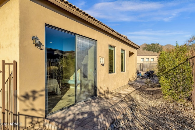 view of property exterior with a patio