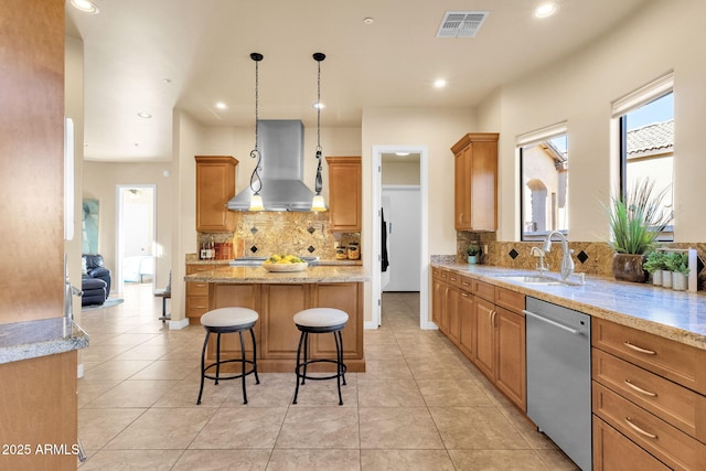 kitchen with extractor fan, dishwasher, sink, hanging light fixtures, and a center island