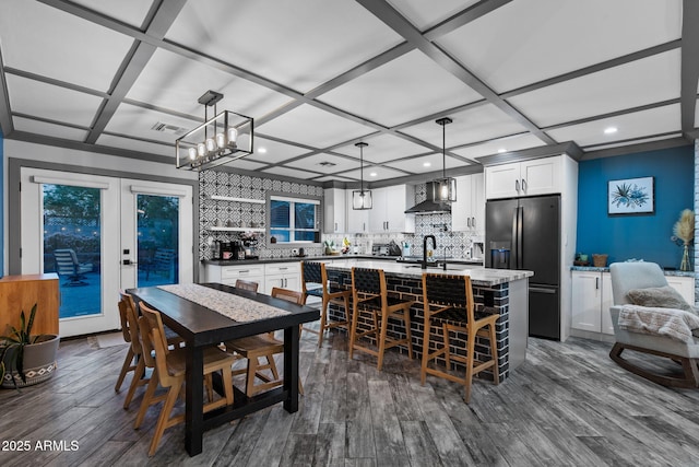 dining space featuring visible vents, recessed lighting, coffered ceiling, and dark wood-type flooring