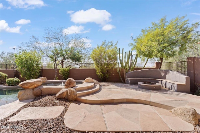 view of patio / terrace with an outdoor fire pit