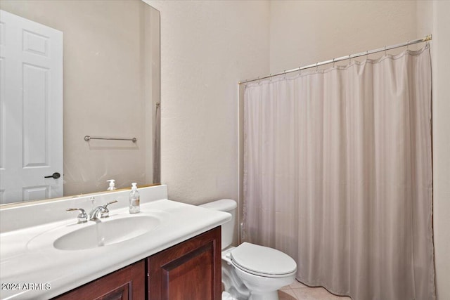 bathroom with vanity, a shower with shower curtain, toilet, and tile patterned flooring