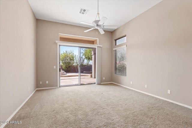 spare room with carpet floors and ceiling fan