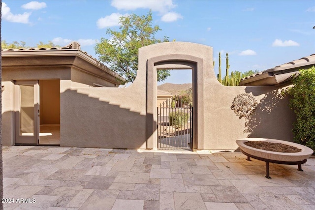 entrance to property featuring a patio area