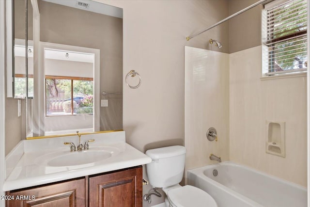 full bathroom with vanity, washtub / shower combination, and toilet