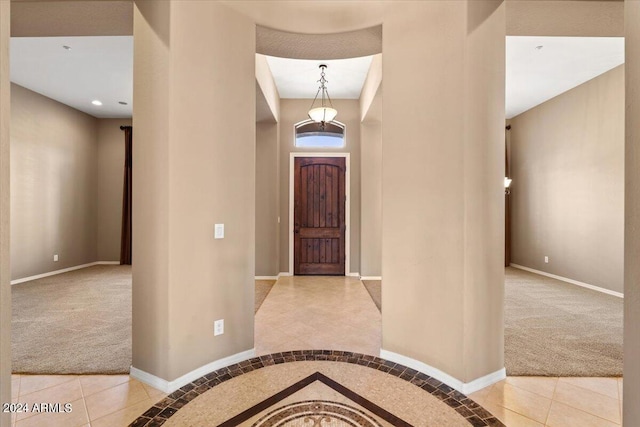 view of carpeted entrance foyer