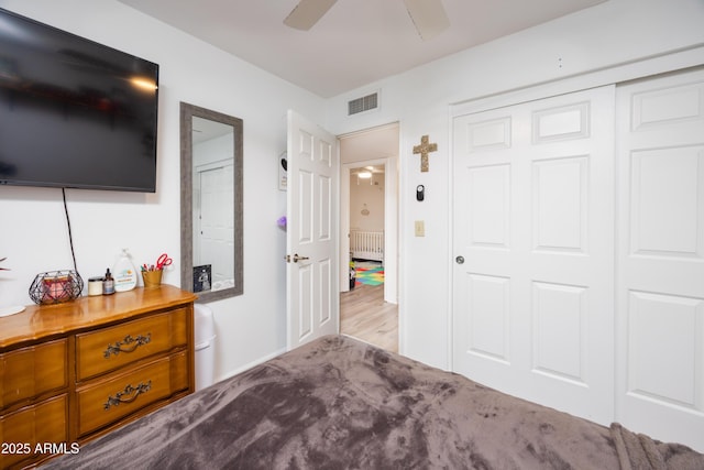 bedroom featuring ceiling fan and a closet