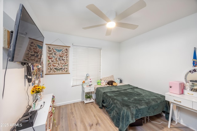 bedroom with ceiling fan and light hardwood / wood-style flooring