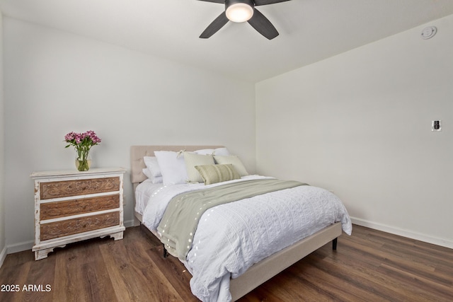 bedroom featuring ceiling fan and dark hardwood / wood-style flooring