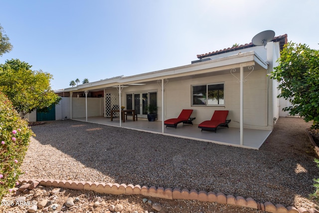 rear view of property featuring a patio