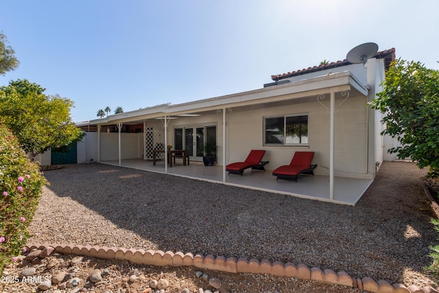 back of property featuring a patio