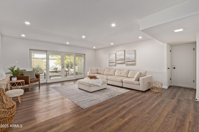 living room with dark wood-type flooring and french doors