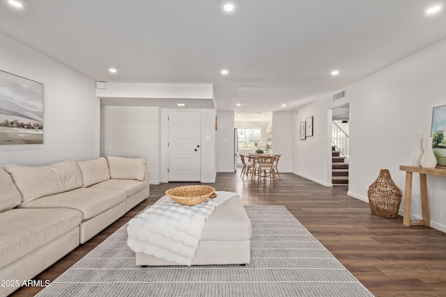 living room featuring dark wood-type flooring