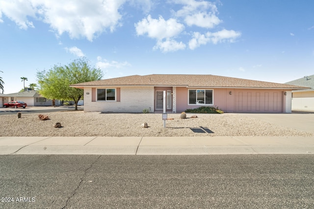 ranch-style house featuring a garage