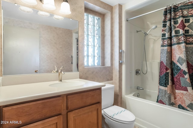 full bathroom featuring vanity, toilet, and shower / bath combination with curtain