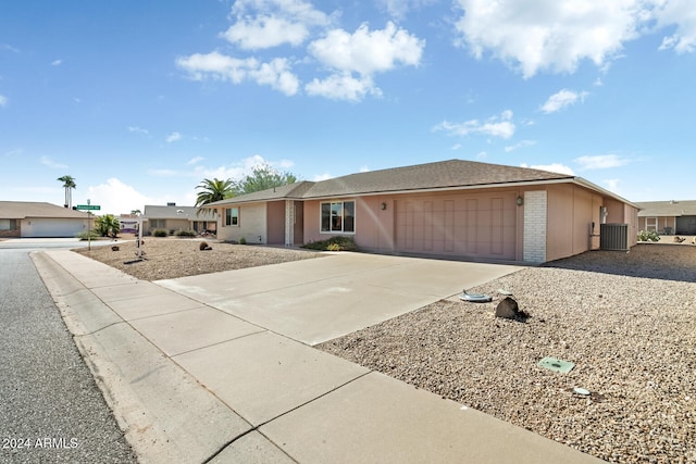 ranch-style house featuring a garage