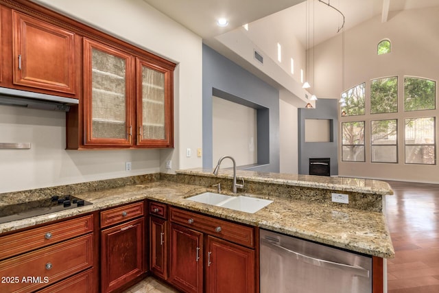kitchen with light stone countertops, black electric cooktop, dishwasher, a sink, and visible vents