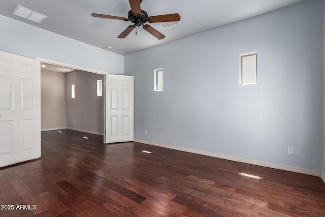 unfurnished room featuring visible vents, ceiling fan, baseboards, and wood-type flooring