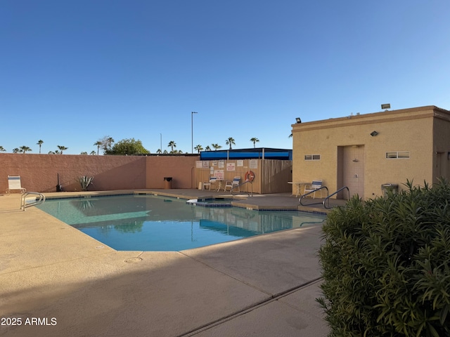 view of swimming pool featuring a patio