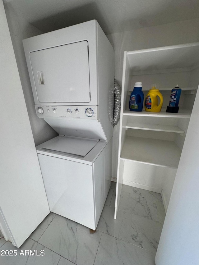 laundry room featuring stacked washer / dryer