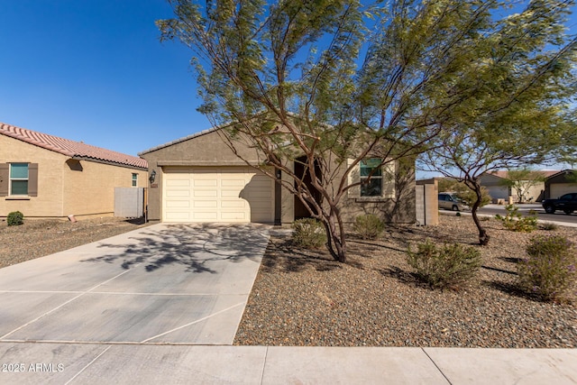 single story home featuring a garage, driveway, and stucco siding