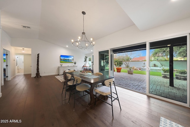 dining room featuring lofted ceiling, a chandelier, visible vents, baseboards, and wood-type flooring