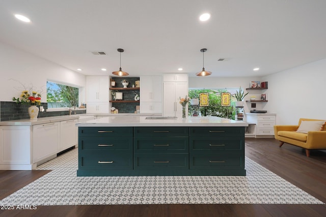 kitchen featuring visible vents, white cabinets, light countertops, open shelves, and dark wood finished floors