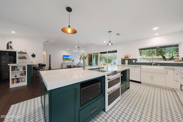 kitchen featuring green cabinets, light countertops, white electric range oven, and white cabinetry