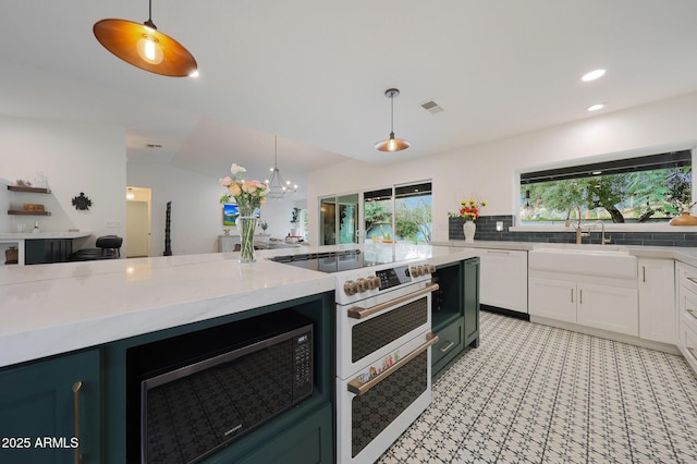 kitchen with visible vents, decorative backsplash, white cabinets, decorative light fixtures, and white electric range