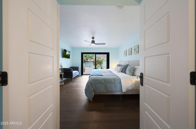 bedroom with dark wood-type flooring and a ceiling fan