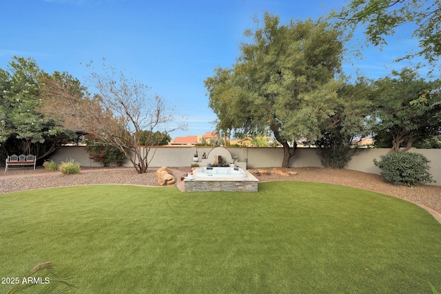 view of yard with a fenced backyard