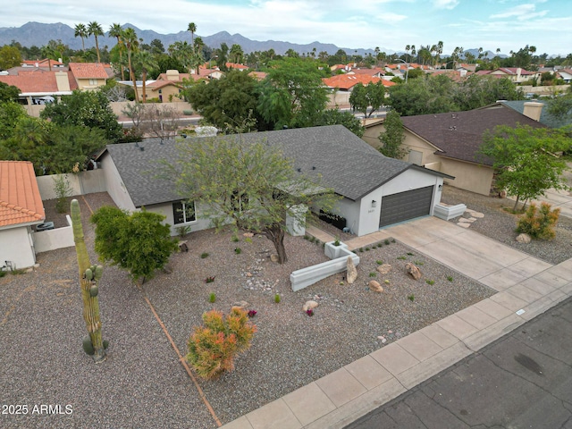 drone / aerial view with a residential view and a mountain view